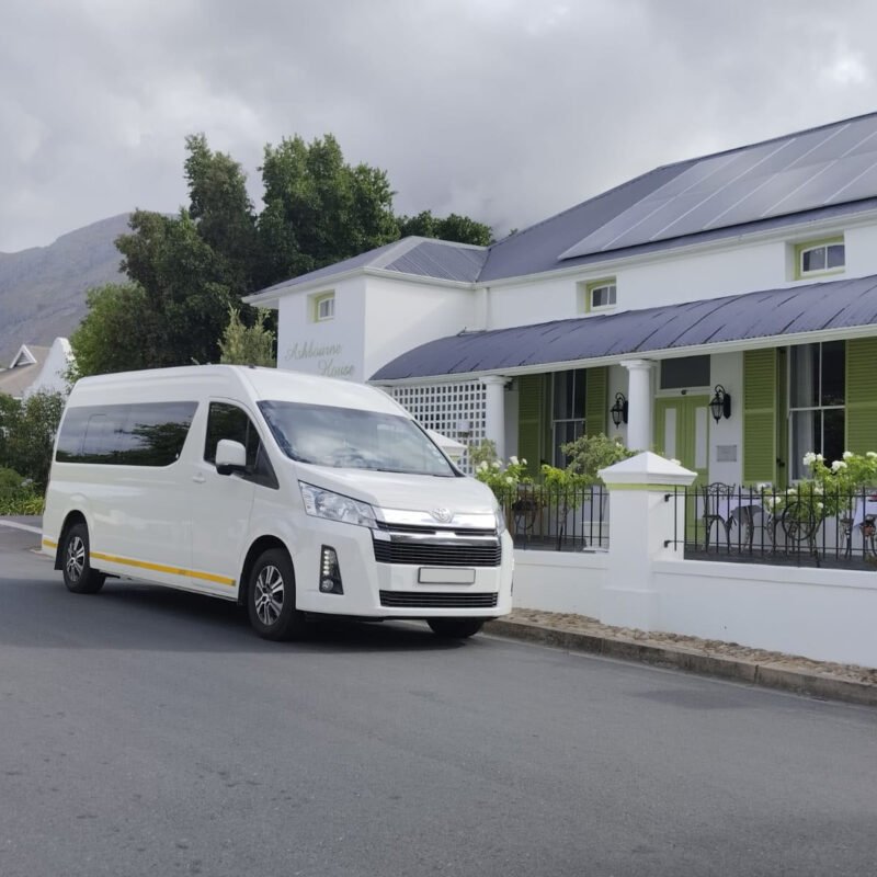 White car in front of white building